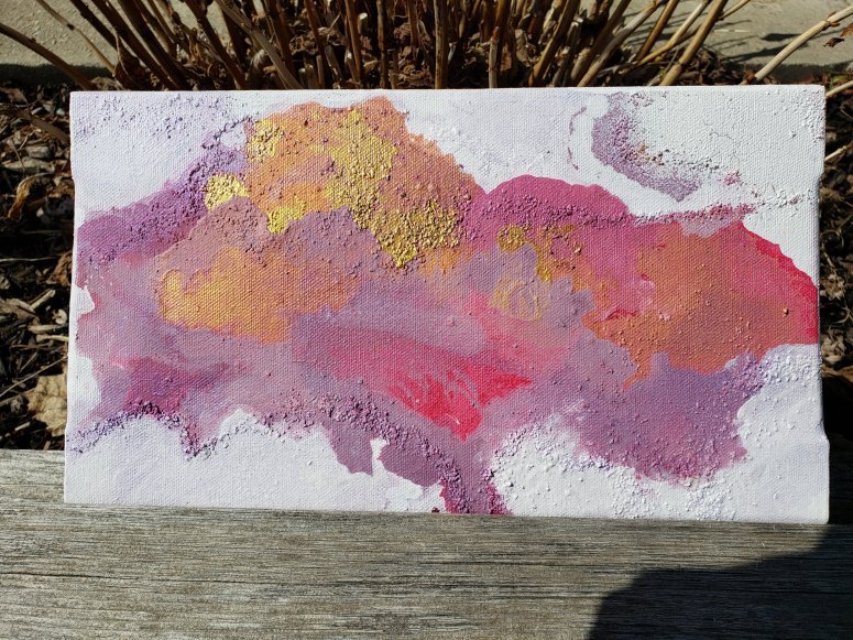 Pink, magenta, gold inkblot bright colour with white negative space