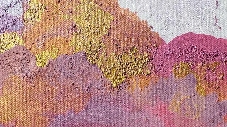 Pink, magenta, gold inkblot bright colour with white negative space