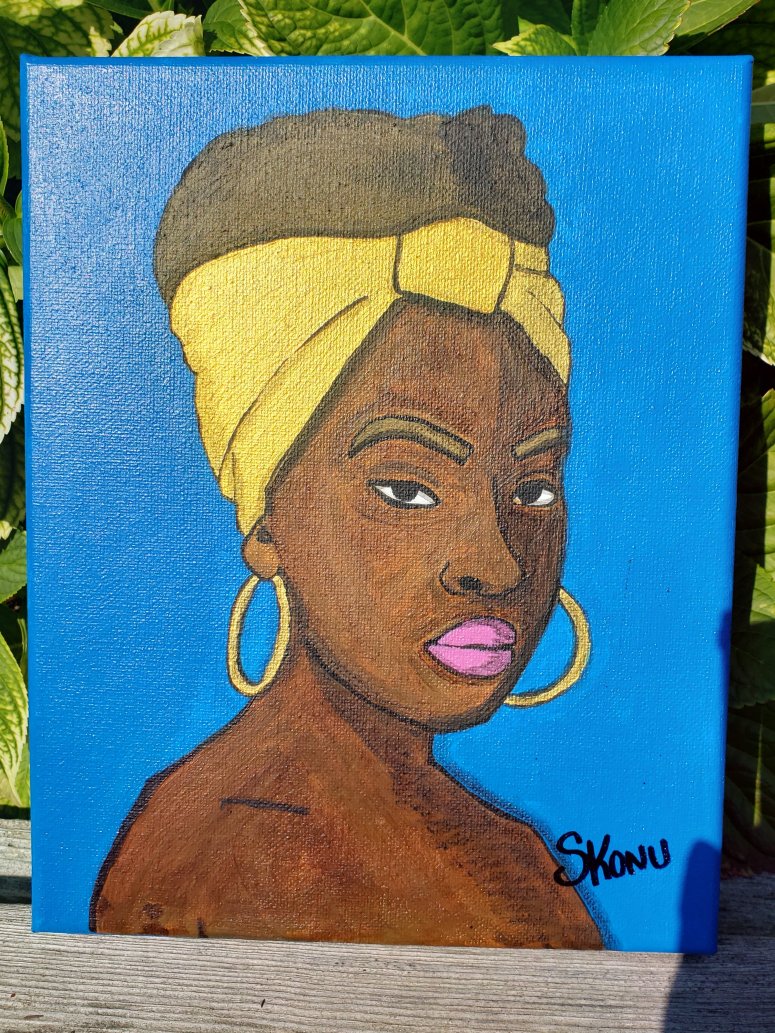African woman with gold accent and blue background  acrylic on canvas by Stephanie Konu 