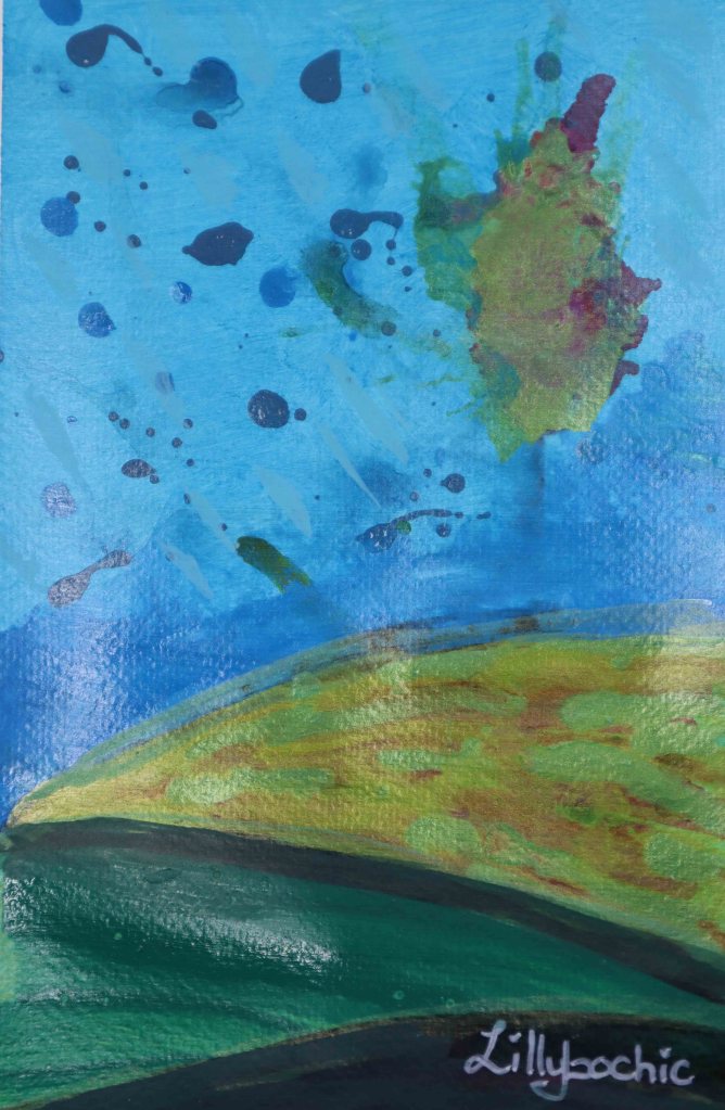 Hillside greens with blue sky and a tree in the background